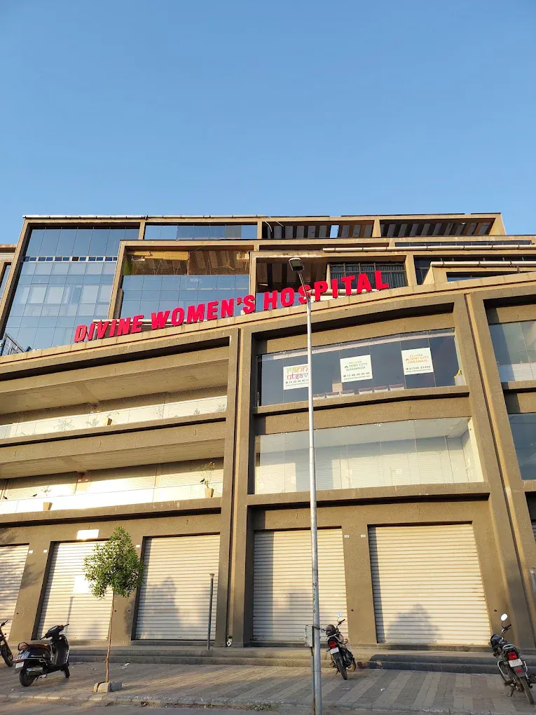 The Divine Women's Hospital building signage in Gota - Jagatpur, Ahmedabad