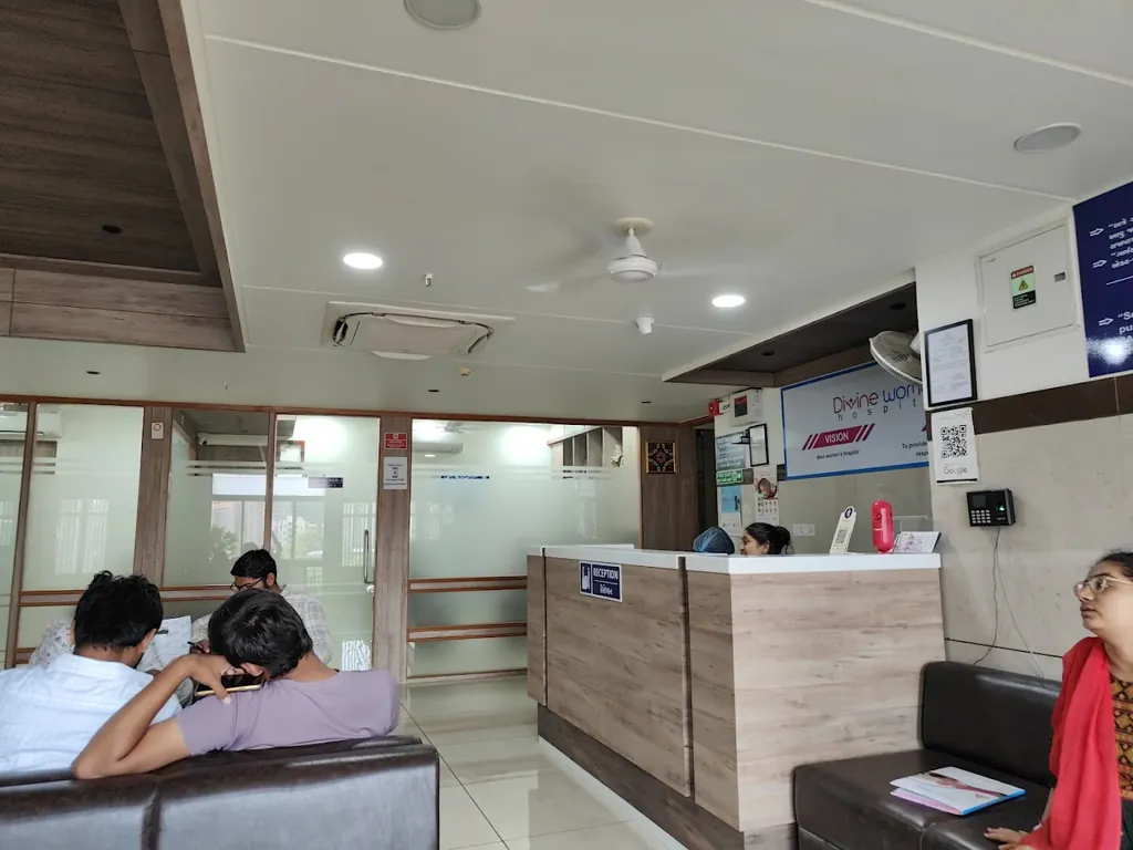 Patients waiting at the reception desk inside Divine Women's Hospital